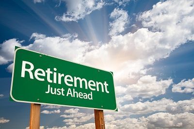 Highway road sign that says "Retirement Just Ahead"